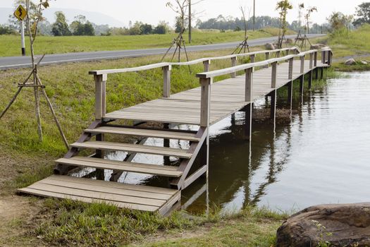 wood bridge cross the canal.