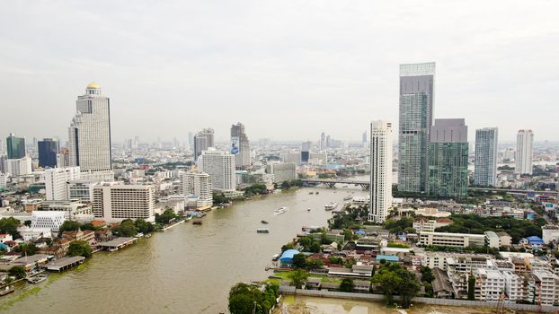 top view ship on Chao Phraya river, bridge and city scape in Ban