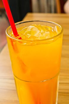 Orange juice with ice  in a glass place on the table 