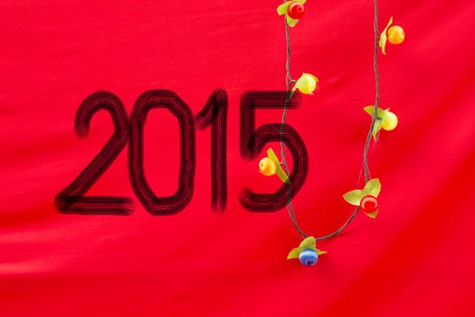 Chinese Calligraphy 2015 Year of the Goat 2015 on red silk fabric background