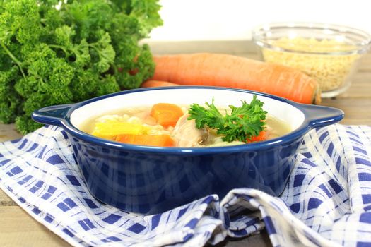 Alphabet soup with vegetables and chicken meat