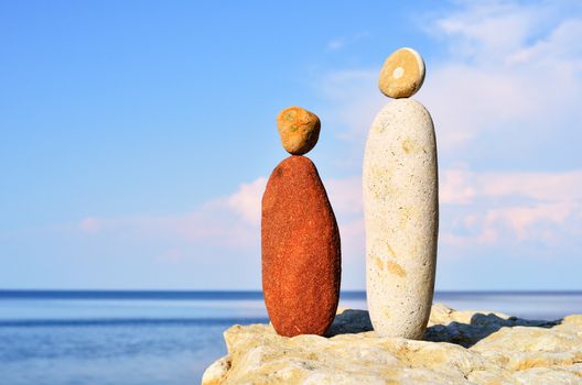 Figurines of man and woman of the stones at the sea