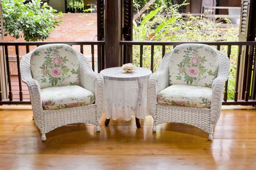 Outdoor rest area with white nice armchair sofa,