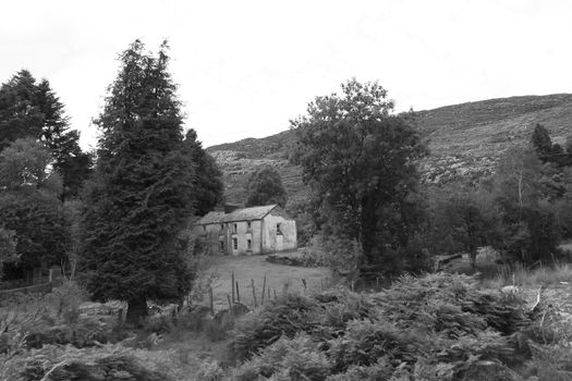 old abandoned farmhouse in the mountains of county Kerry Ireland in black and white