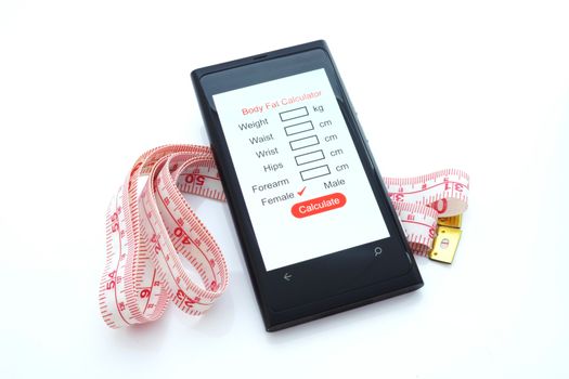 Smart phone with body fat calculator and measuring tape on white background