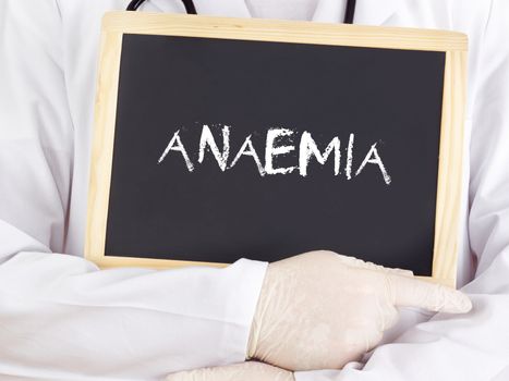 Doctor shows information on blackboard: anaemia