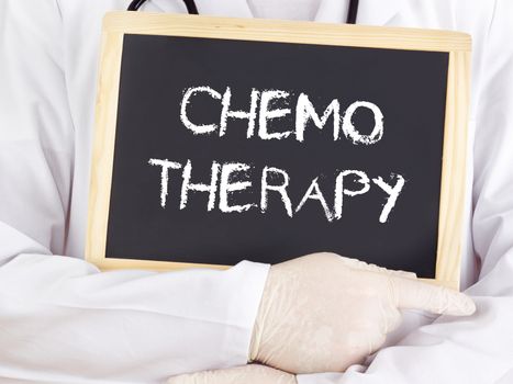 Doctor shows information on blackboard: chemotherapy