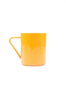 Orange plastic glass on a white background. White background with use easily.