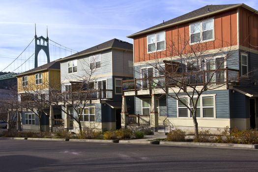 Row of new duplexes homes overshadowing the St.John bridge Oregon.