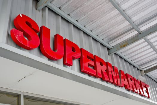 Supermarket sign on building