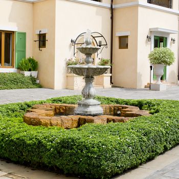 Small backyard fountain in a garde