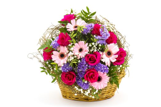 colourful flowers in a basket on white background