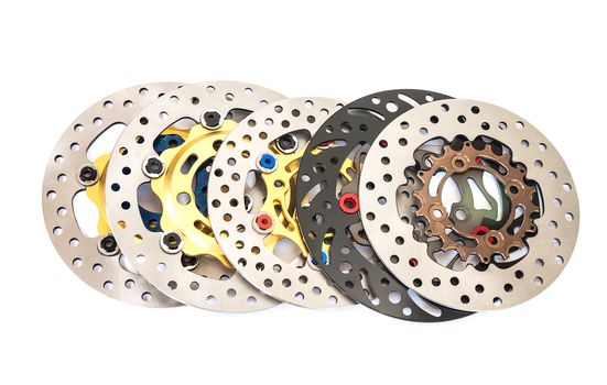 Group of new disc brake for motorcycle on white background