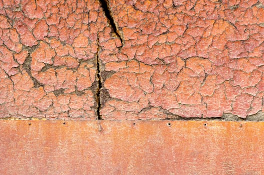 Old orange damaged surface of wooden and iron desk.