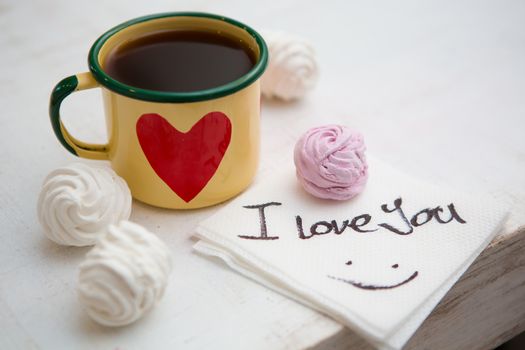 Cup Of Coffee. Coffee in cup with red heart and dessert. Handwriting I love you. Creative concept. 