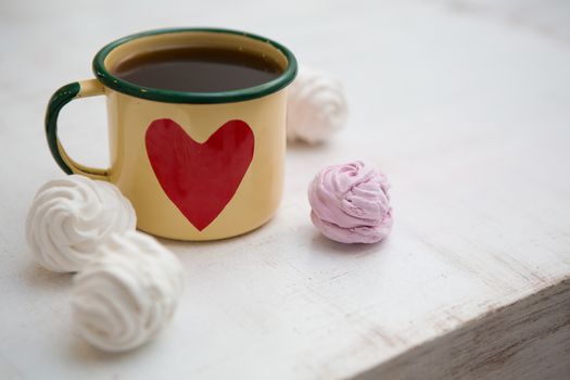 Cup Of Coffee. Coffee in cup with red heart and dessert