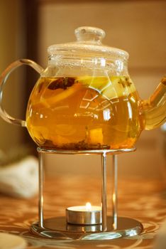 teapot of herbal tea on table 