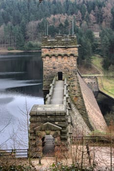 derwent reservoir dam breakwater under a cloudy sky