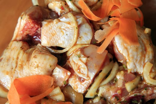 Pieces of raw chicken in sauce with vegetables marinated barbecue