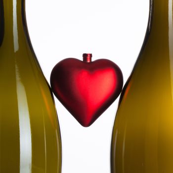 Empty bottles of wine and red heart