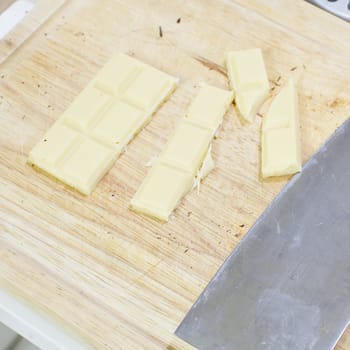 white chocolate piled up on a cutting board