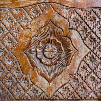 Pattern of flower carved on wood background