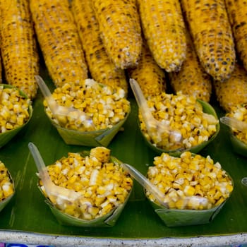 Organic Grilled Corn on the grille with flames ready to sale and eat.