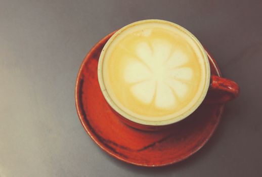 Cappuccino or latte coffee with retro filter effect 
