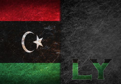 Old rusty metal sign with a flag and country abbreviation - Libya