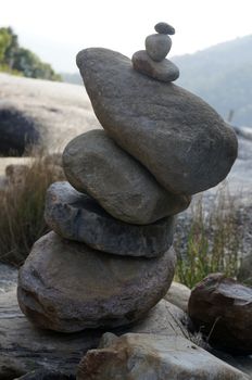 Great pyramid of stones on the background, of wild nature.