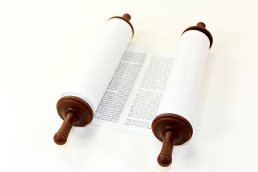 a Torah scroll in front of white background