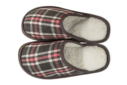 Men's slippers in a cage isolated on white background