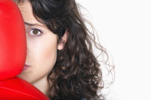 fearful young woman with red boxing gloves