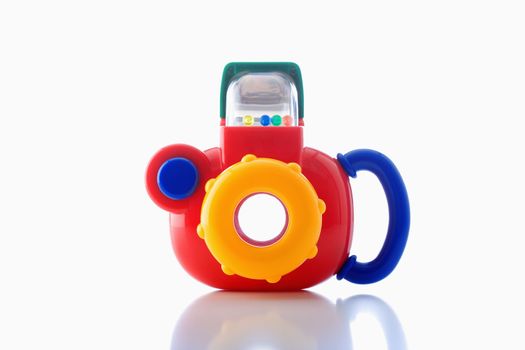 colorful plastic toy camera on white background