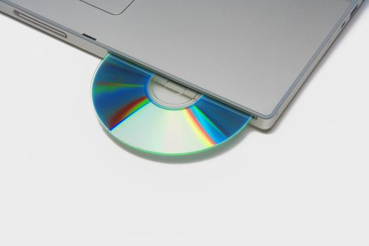 silver laptop with cd / dvd isolated on white background - clipping path