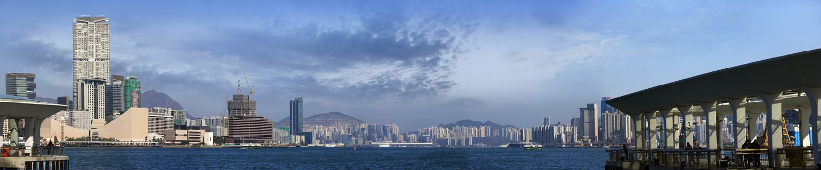 Hong Kong, Hong Kong S.A.R. - JENUARY 29, 2014: Star ferry crossing the Victoria Harbor with a view of Hong Kong Island skyline in the background.