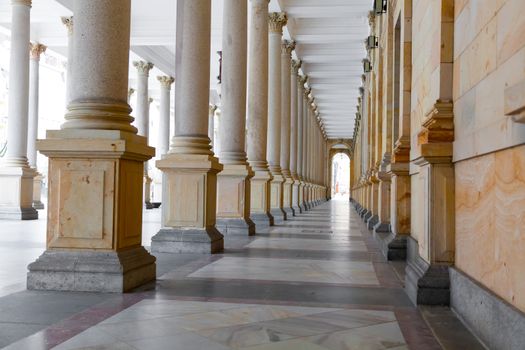 KARLOVY VARY (CARLSBAD), CZECH REPUBLIC  - DECEMBER 8,2014: The Mill colonnade in Karlovy Vary (Carlsbad) -- famous spa city in western Bohemia, very popular tourist destination in Czech Republic (famous for its hot springs)