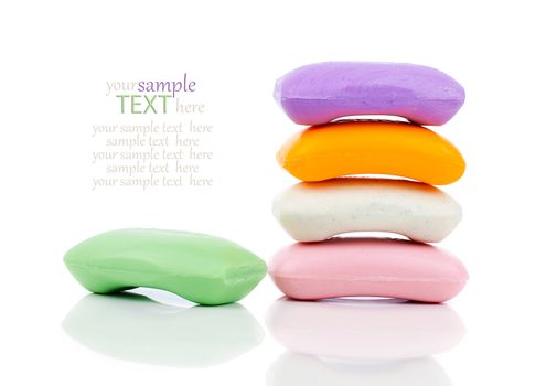 Stack of new colorful Soap Bars on white background.