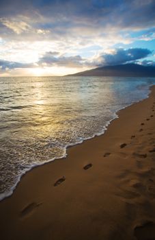Sunset and Beach Footprints on Maui in Hawaii