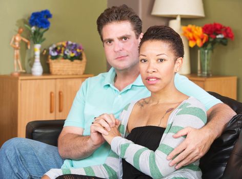 Loving mixed European and African couple sitting together