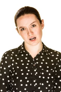 A confused looking young woman on white background