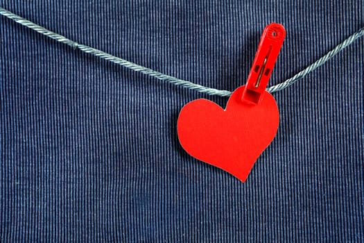 Red Heart Shape on the Rope on the Textile Background