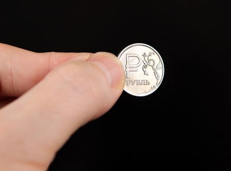 Russian Ruble in the Hand on the Black Background