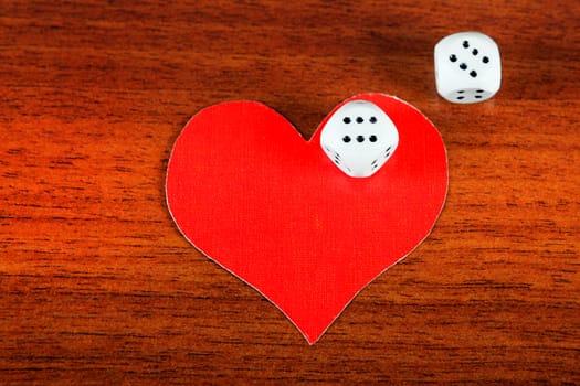 Red Heart Shape with Dices on the Wooden Background