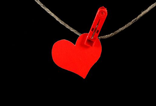 Red Heart Shape on the Rope on the Black Background
