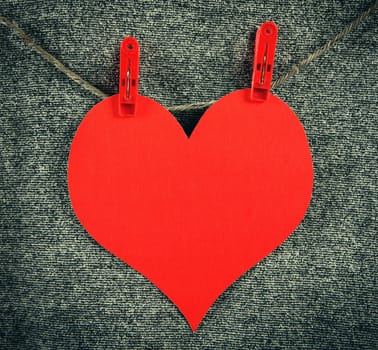 Red Heart Shape on the Rope on the Textile Background