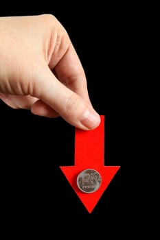 Red Arrow in a Hand with Russian Ruble Down on the Black Background