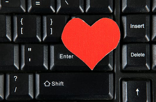 Red Heart Shape on the Computer Keyboard closeup