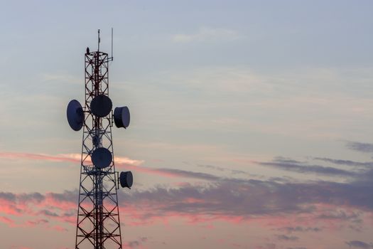 Telecommunication tower structure with sunset sky background 