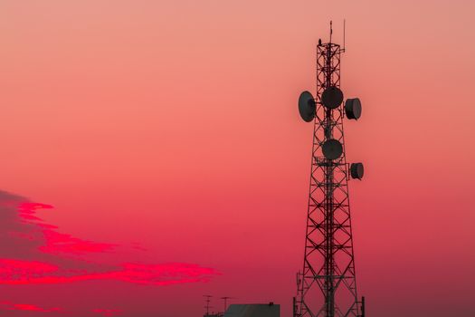 Telecommunication tower structure with sunset sky background